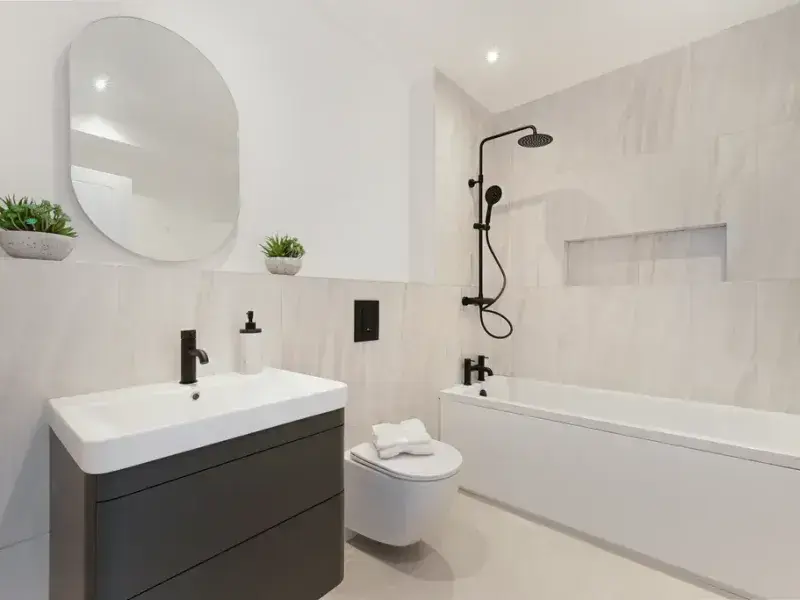 Contemporary family bathroom with bathtub and premium fittings in a newly built home in South London.