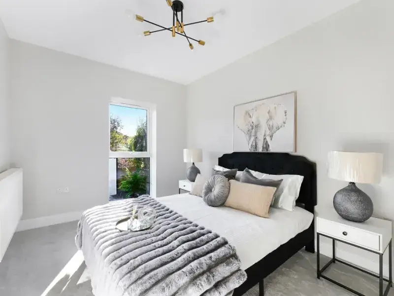 Light-filled double bedroom with neutral finishes in a newly built property.