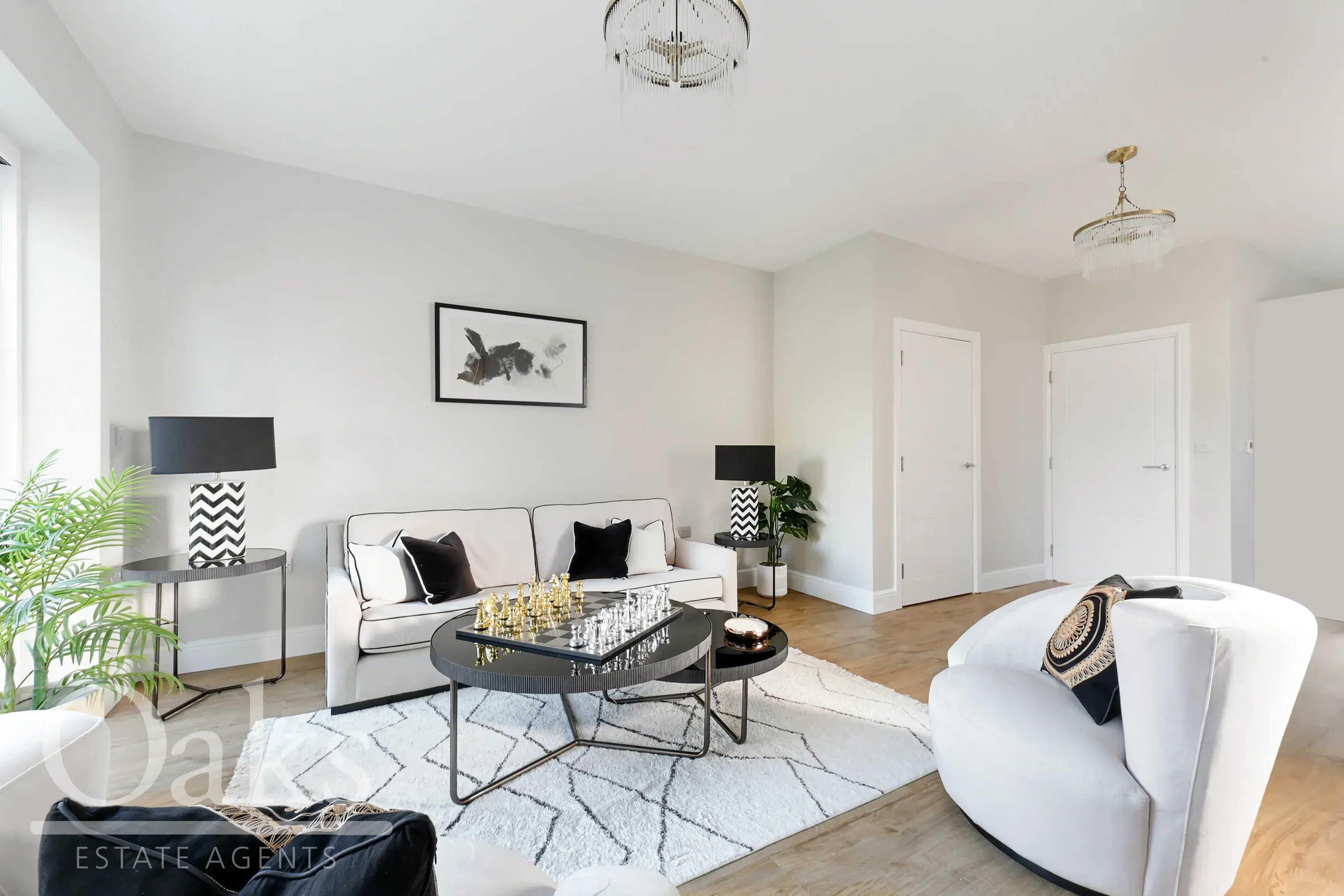 Bright living room with neutral tones, modern furniture and large windows at Byards Croft, Dion Homes.